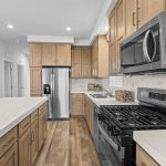 Modern kitchen featuring stainless steel appliances and abundant cabinet space