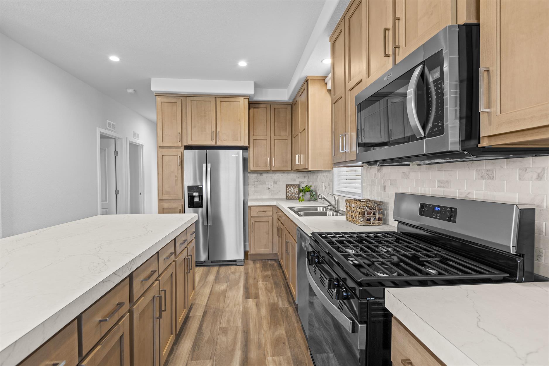 Modern kitchen featuring stainless steel appliances and abundant cabinet space