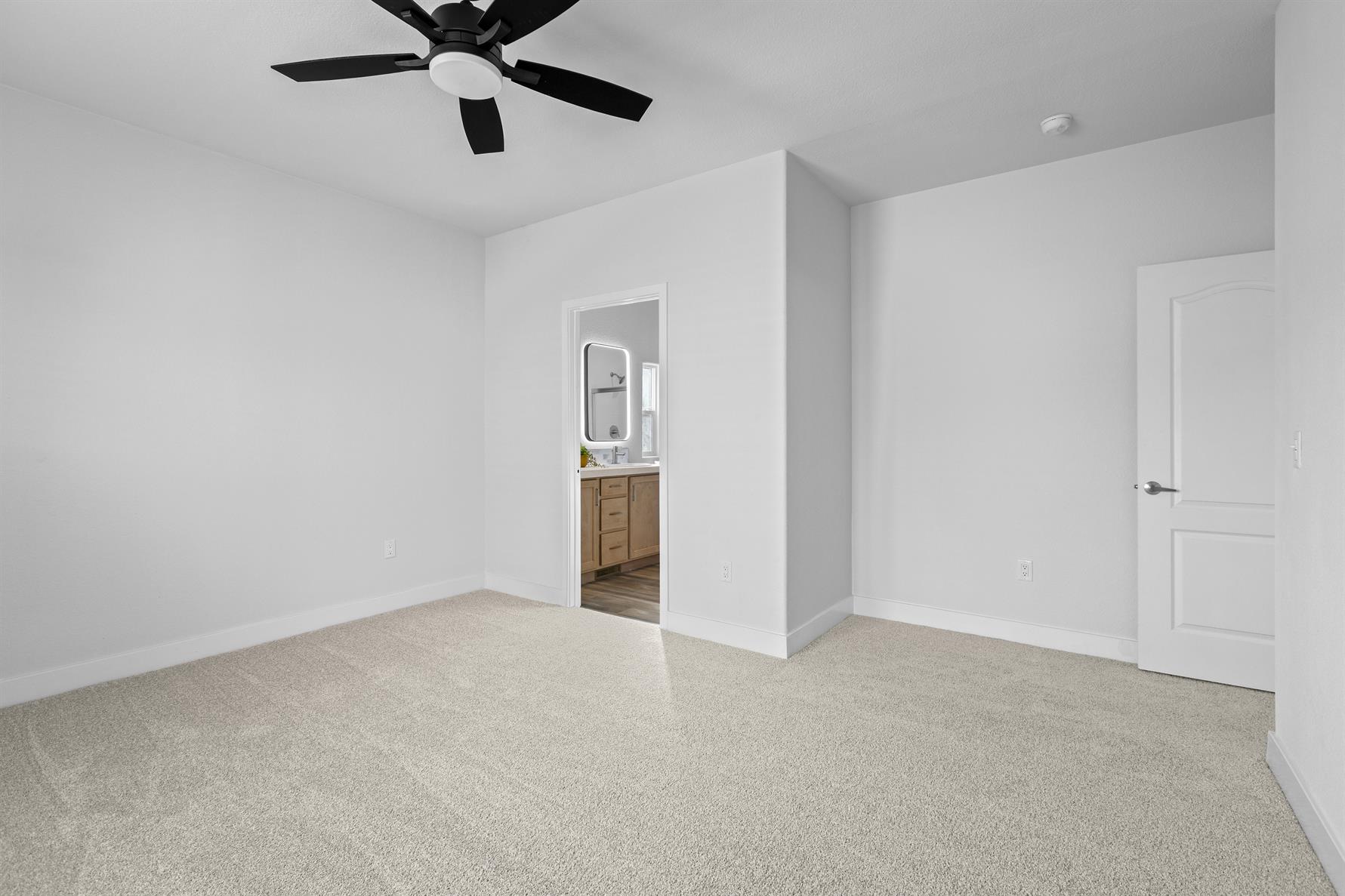 Private primary suite designed for rest and relaxation