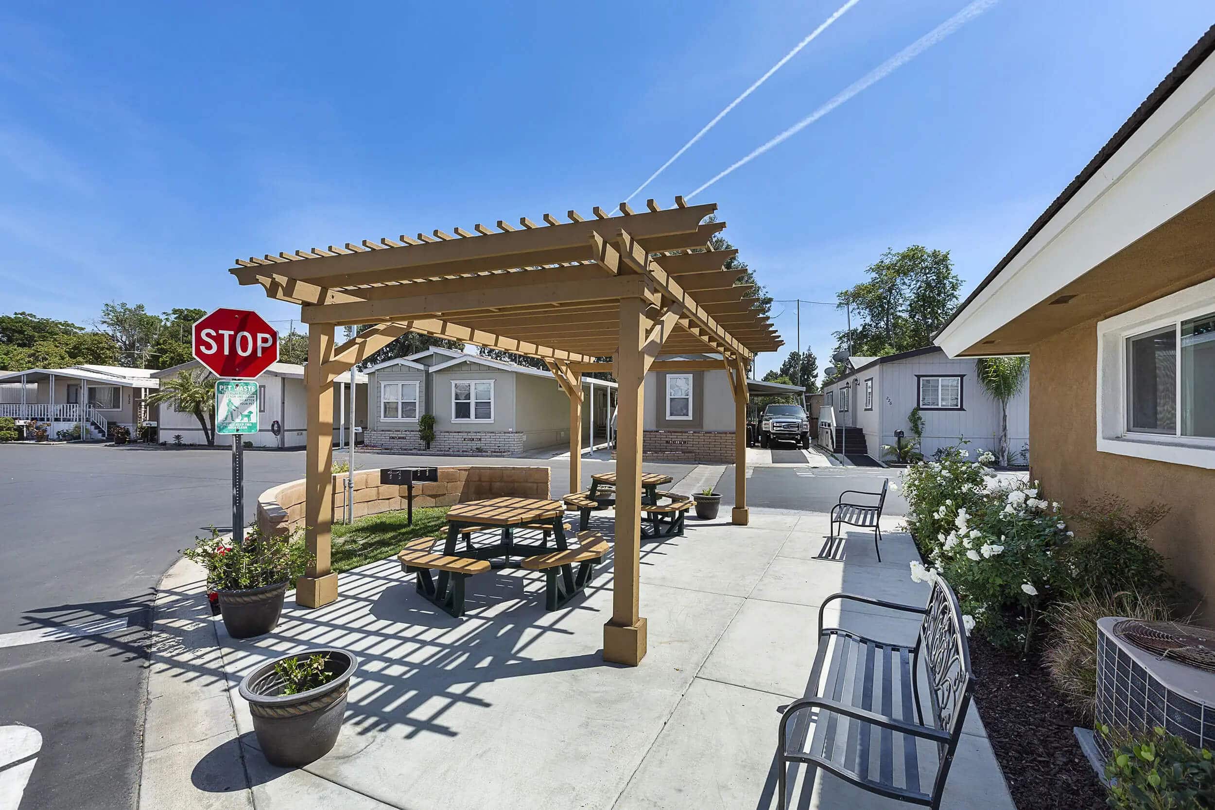 Covered picnic area with BBQ at Holiday Mobile Home Estates, Santa Ana, CA